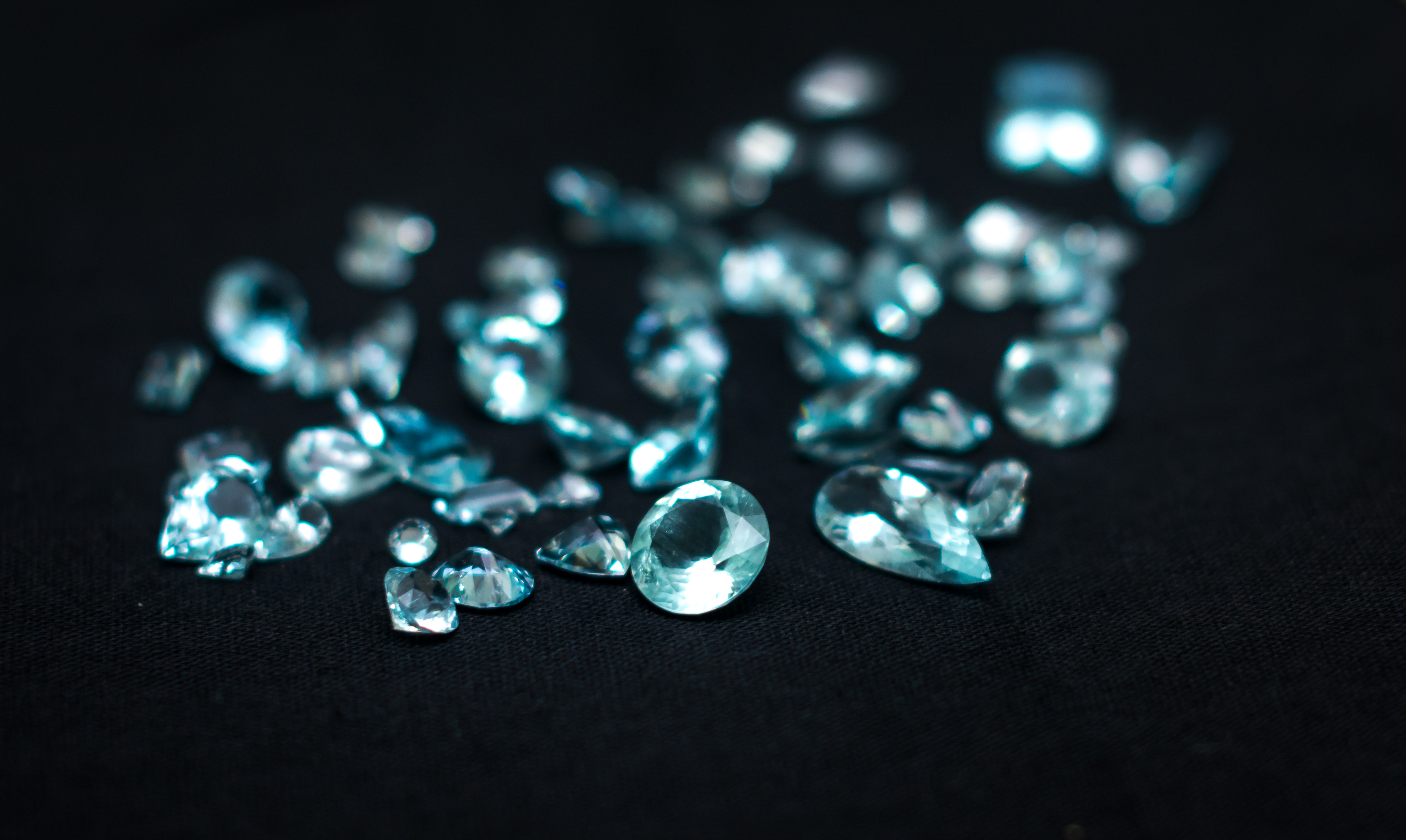 Collection of precision-cut blue aquamarine gemstones